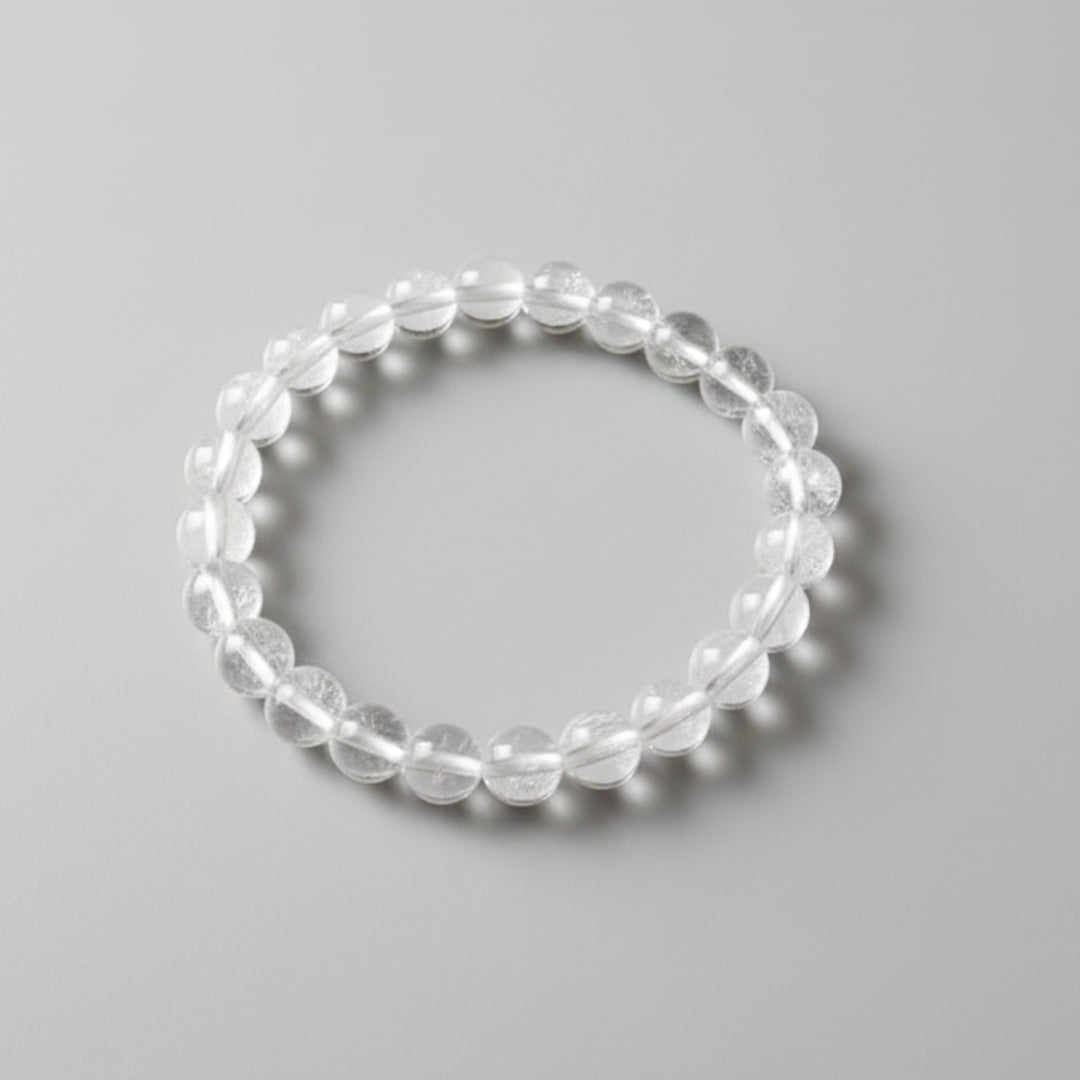 Clear beaded bracelet on a gray background