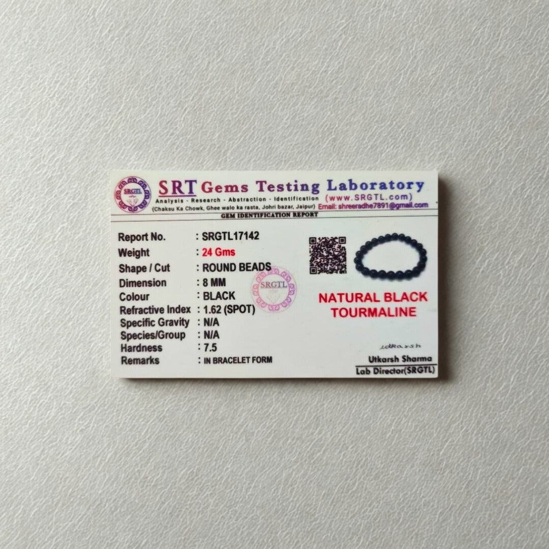 SRT Gems Testing Laboratory identification report card for natural black tourmaline beads on a gray background