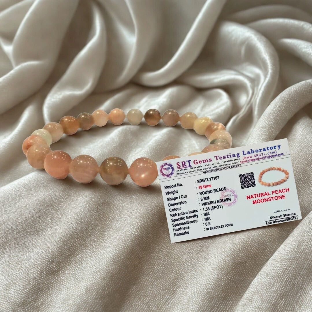 Beaded bracelet with a label on a textured fabric background