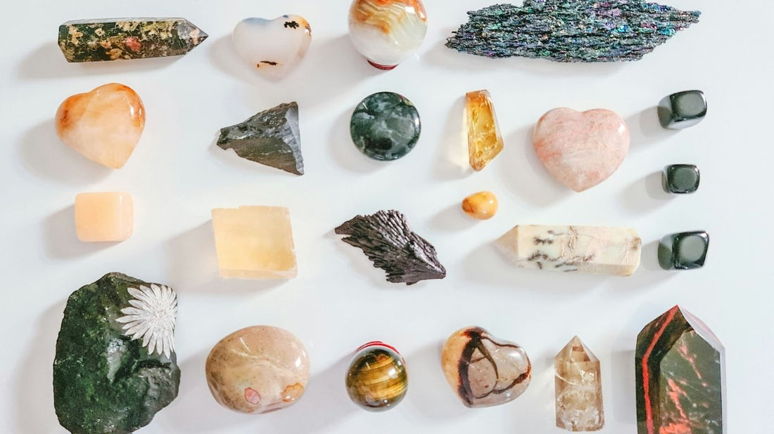 Gemstones arranged in a circle with zodiac signs for each astrological sign – DivineRoots