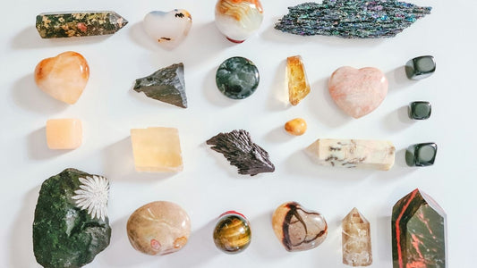Gemstones arranged in a circle with zodiac signs for each astrological sign – DivineRoots