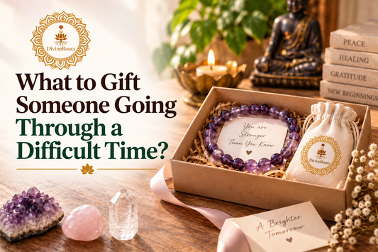 DivineRoots blog hero image showing a thoughtful spiritual gift box with an Amethyst bracelet, Rose Quartz, Clear Quartz and supportive message cards, representing meaningful gift ideas for someone going through a difficult time.