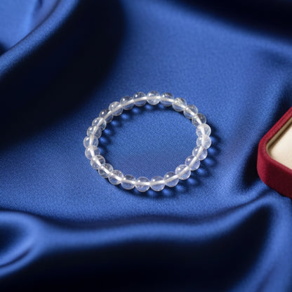 Beaded bracelet on a blue fabric background