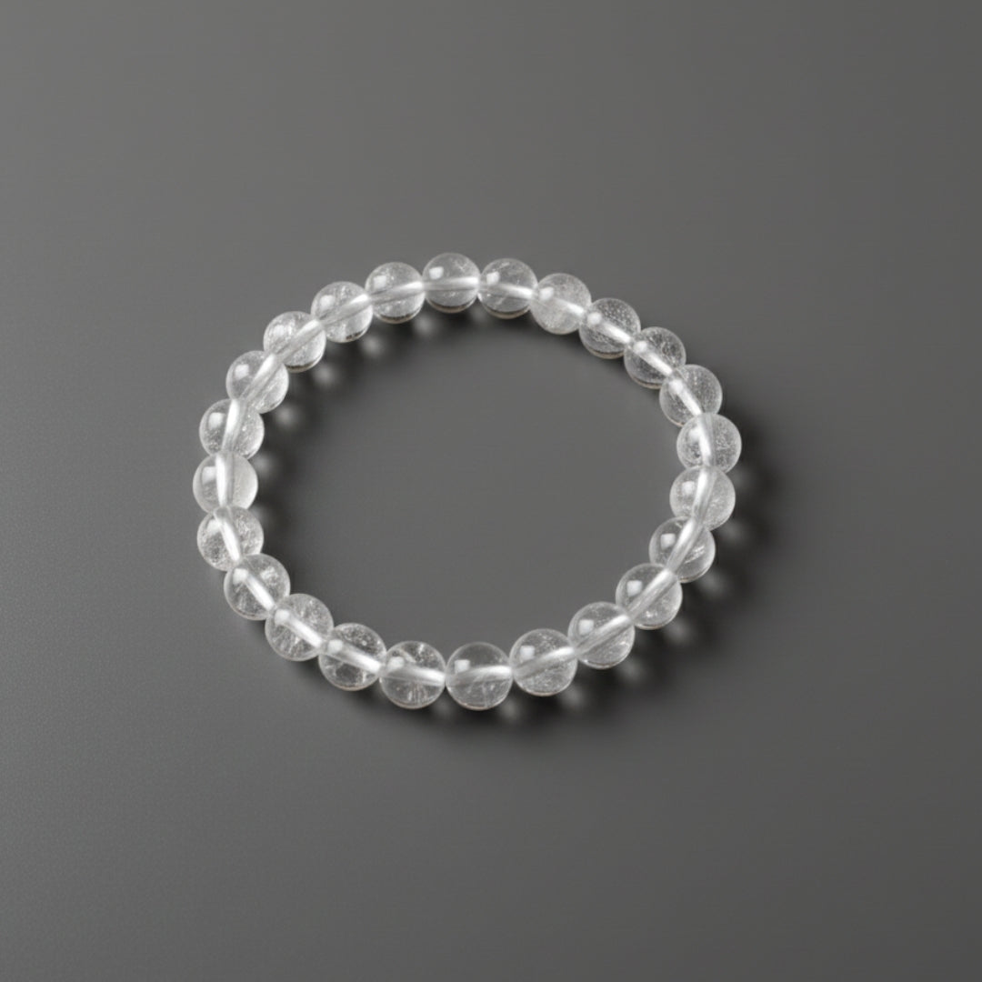 Clear beaded bracelet on a dark gray background