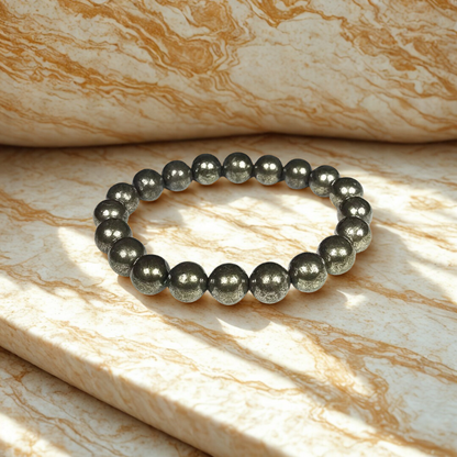 Black beaded bracelet on a marble surface