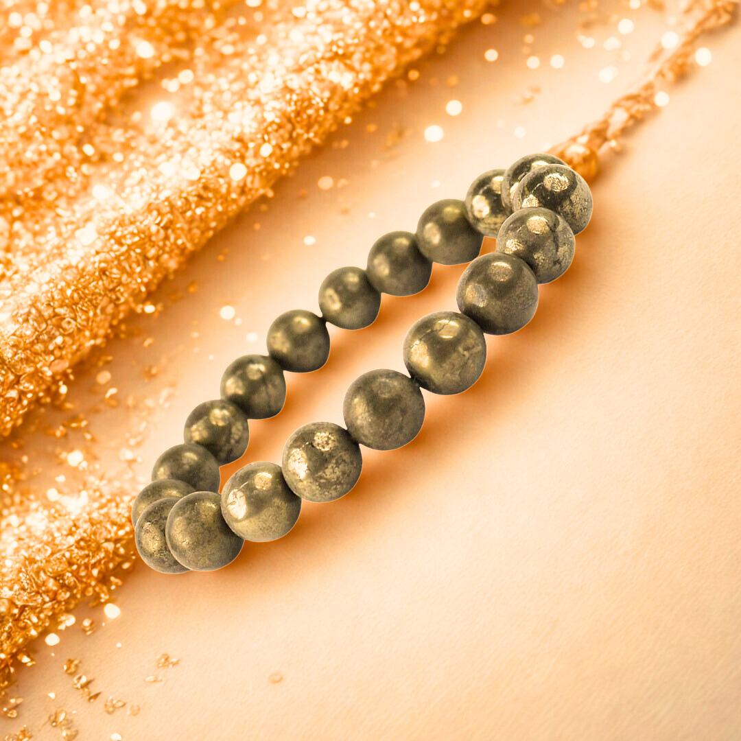 Beaded bracelet on a glittery gold background