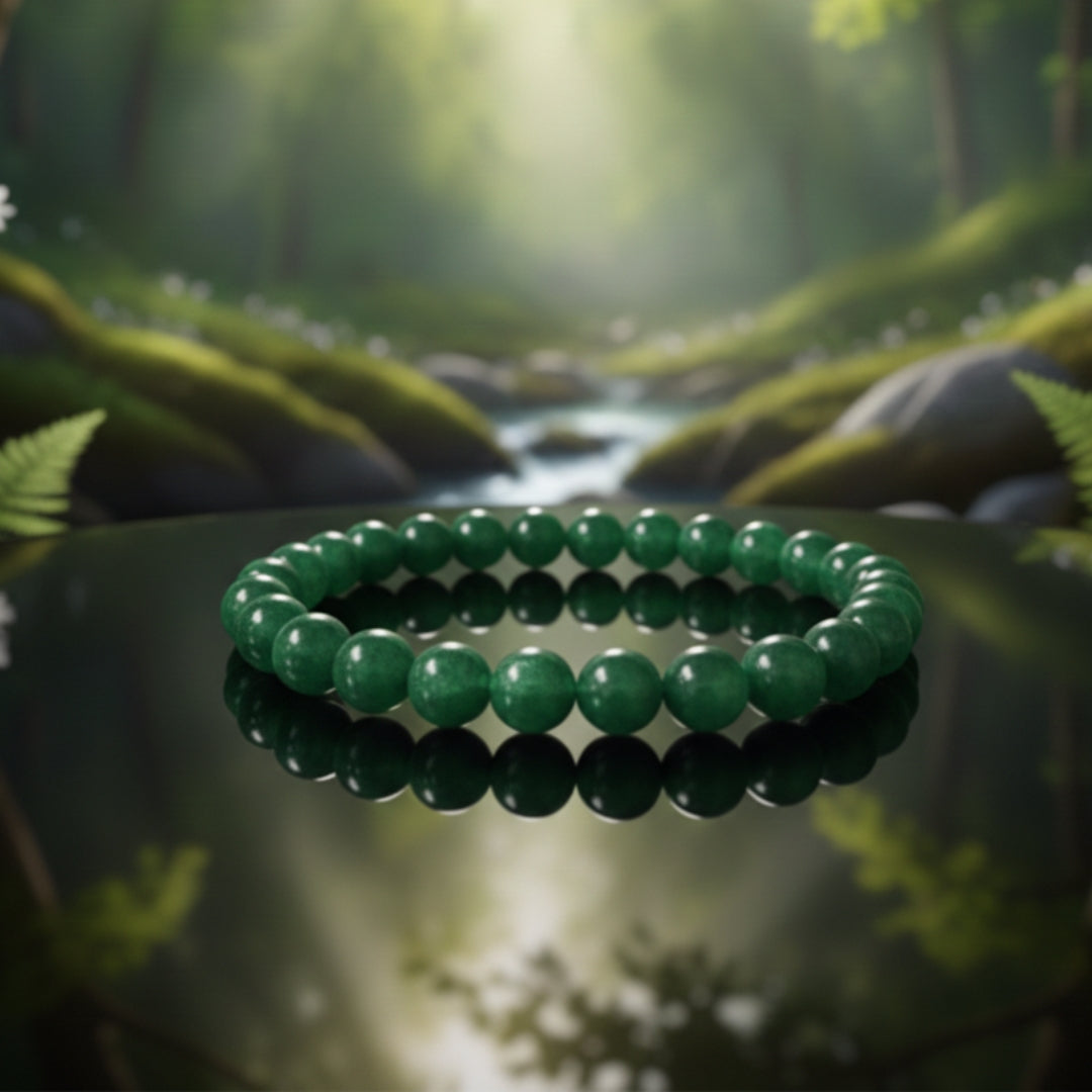 Green beaded bracelet on a rock with a forest background