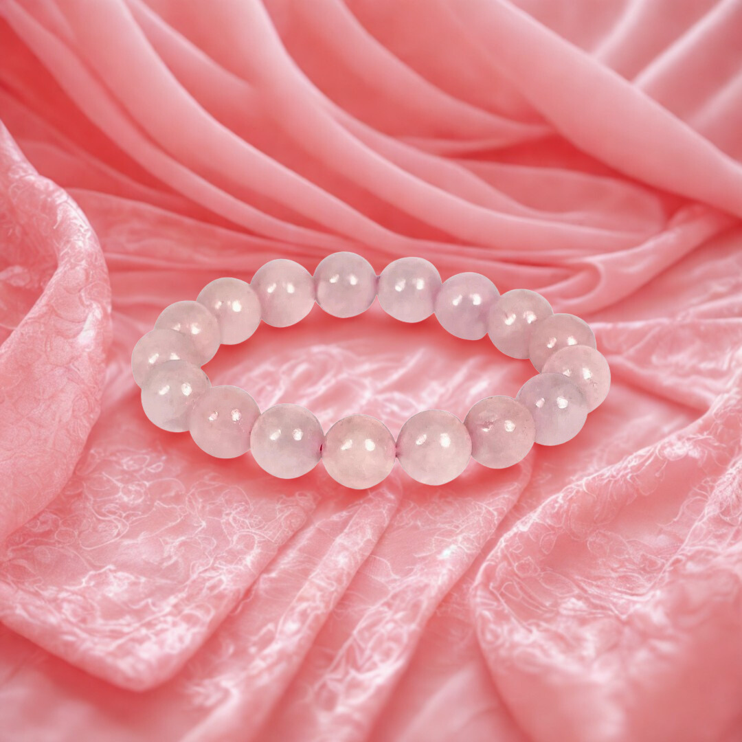 Pink beaded bracelet on a pink fabric background