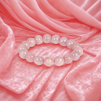 Pink beaded bracelet on a pink fabric background