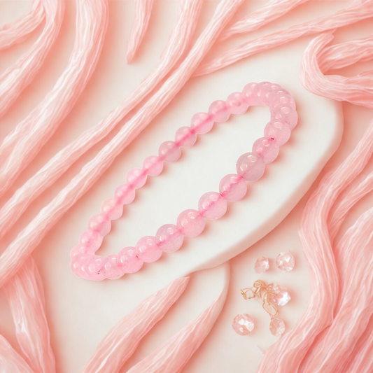 Rose Quartz Gemstone Bracelet on a pink textured background