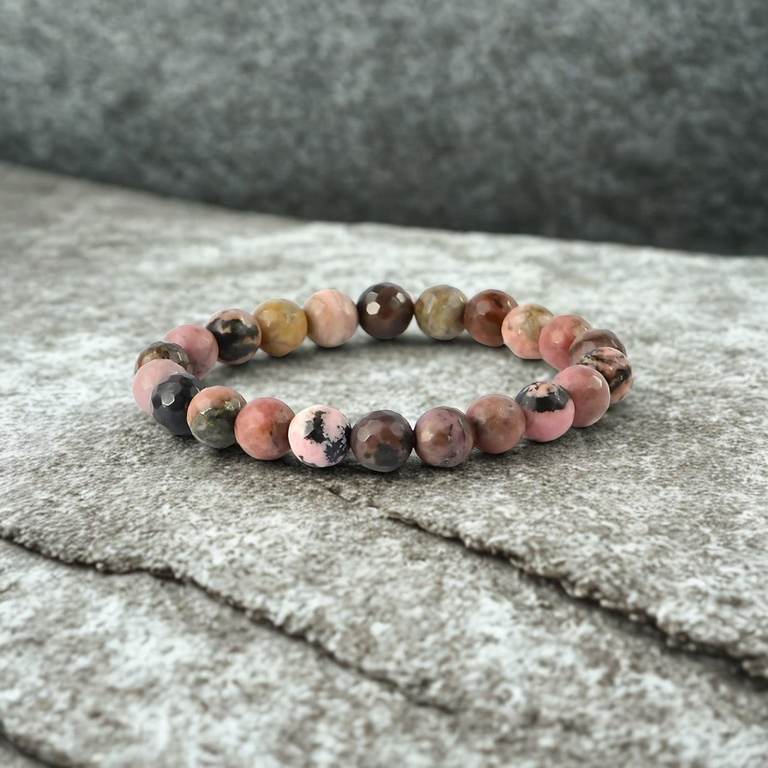 Multicolored beaded bracelet on a textured surface