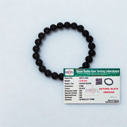 Black beaded bracelet with a Shree Radhe Gem Testing Laboratory card on a white background