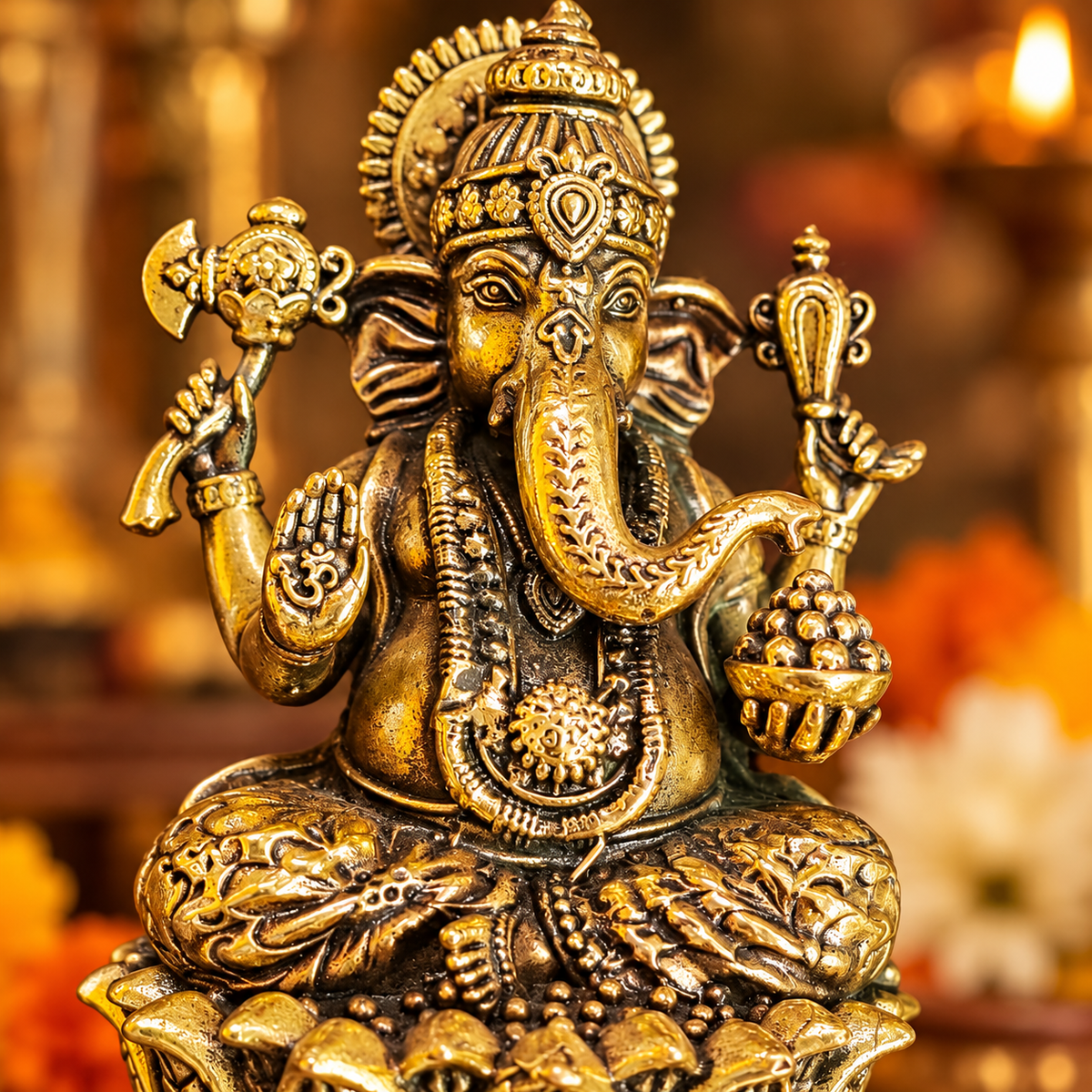 Detailed view of Ganpati murti showing crown, trunk, traditional jewellery and lotus base
