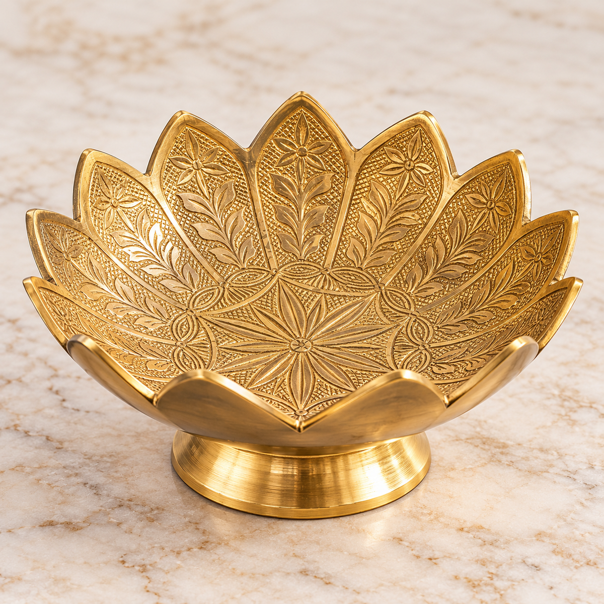 Golden brass lotus bowl with intricate floral engravings and raised pedestal for crystals and spiritual décor