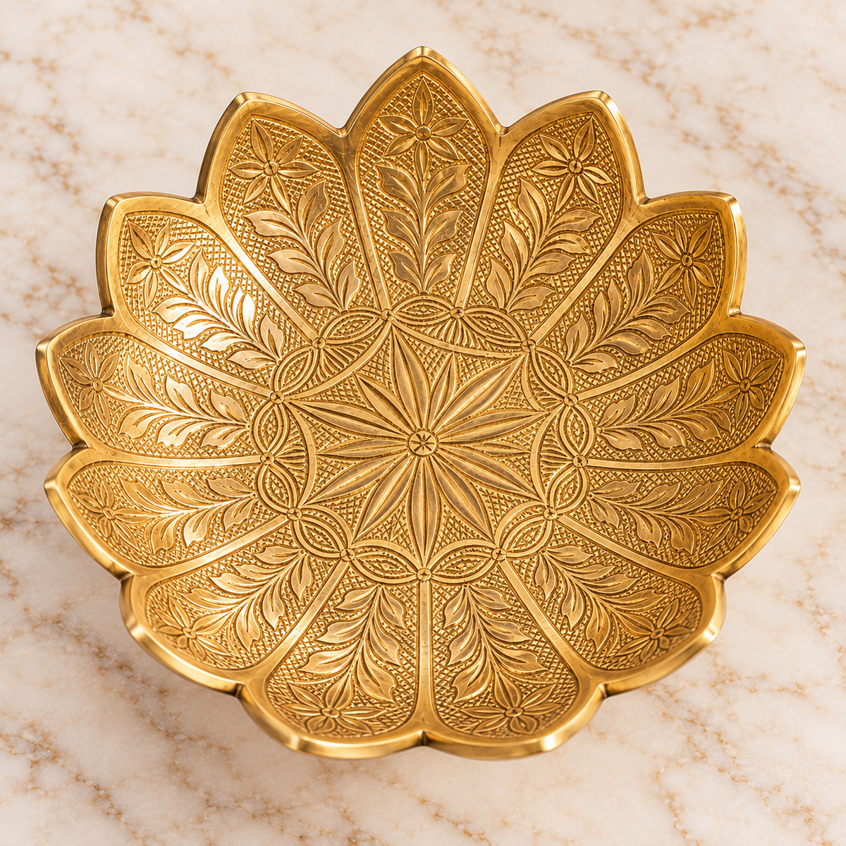 Top view of 14 cm brass lotus bowl showing engraved floral and leaf patterns on decorative petals