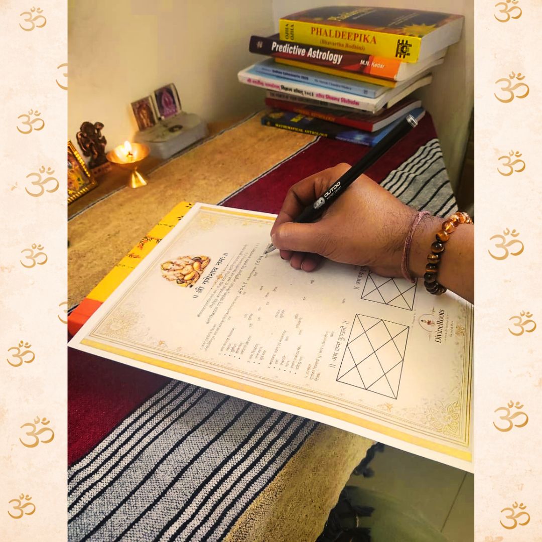 Astrologer preparing handwritten Janam Kundali with pen on traditional Vedic patrika at a spiritual workspace