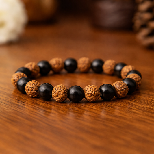 Karungali and Rudraksha Combo Bracelet on a wooden surface