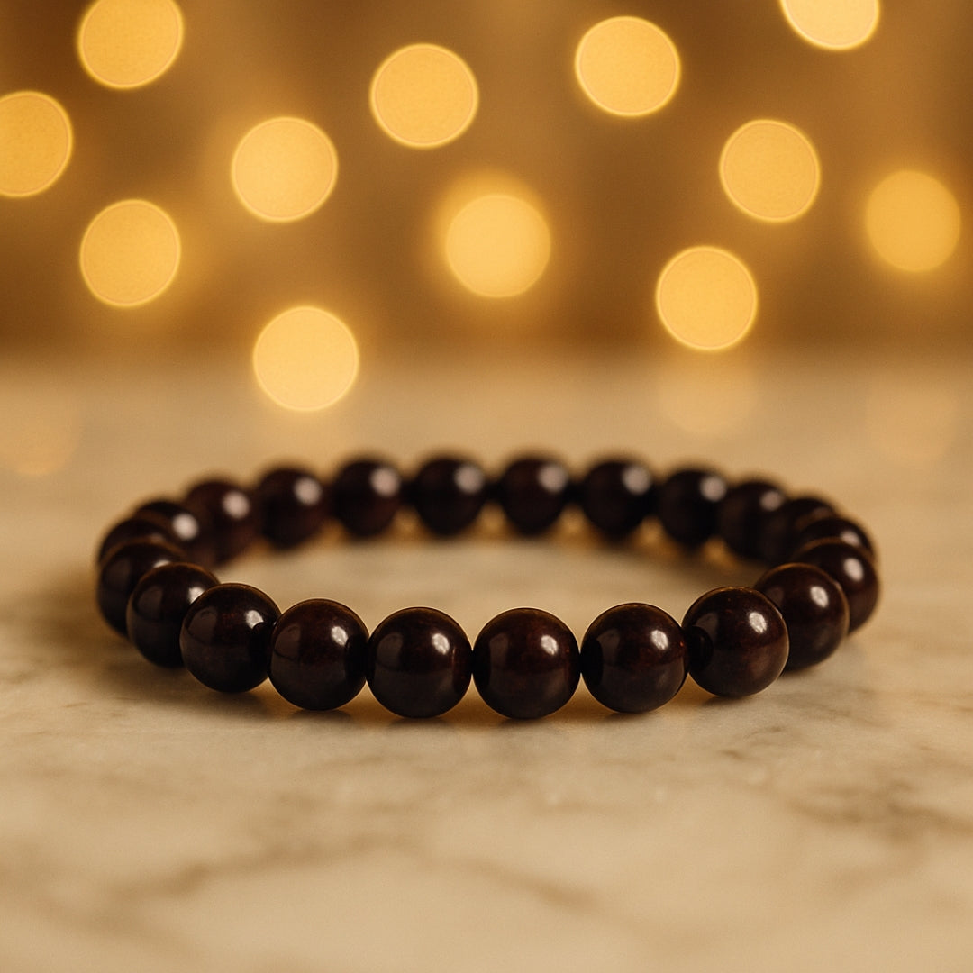 Close-up of polished Garnet beads with warm background lights