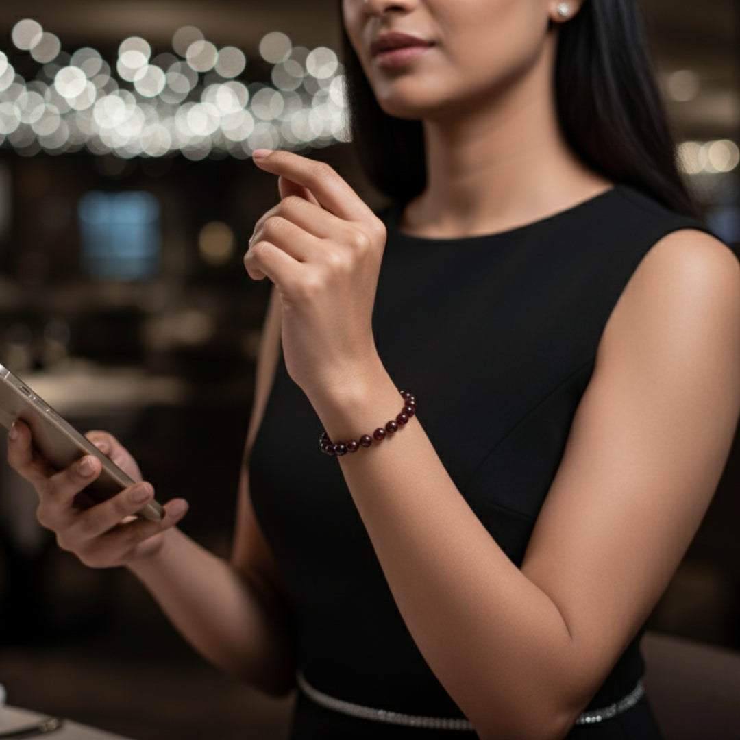 Woman wearing a Garnet bracelet with a black outfit