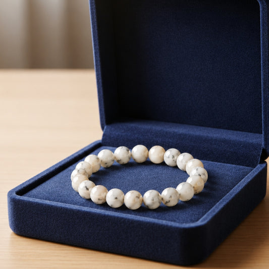 Natural white Opal bracelet inside an open blue velvet gift box